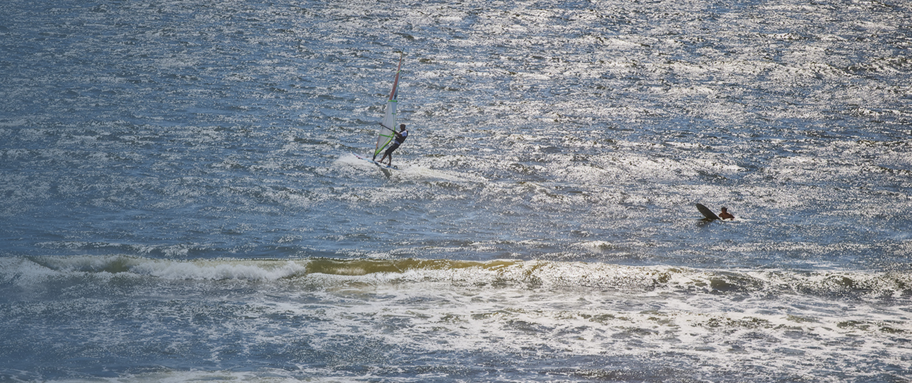 Morning view of people doing marine sports as seen from UMITO