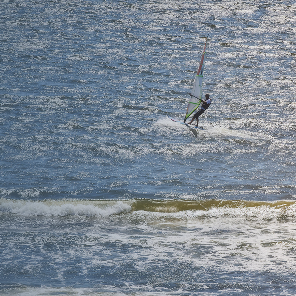 Morning view of people doing marine sports as seen from UMITO